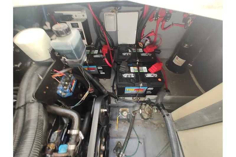 Slide: The Image of Engine compartment of 2003 Sea Ray Sundancer 280 with batteries and wiring. - 34