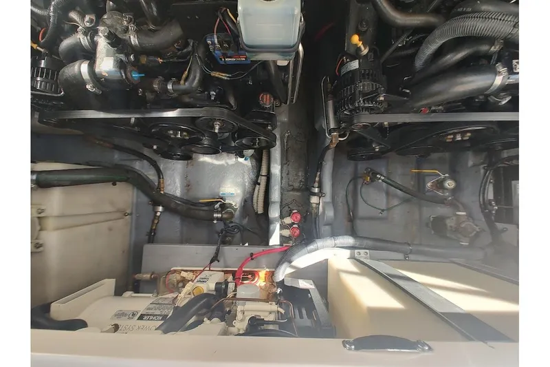 Slide: The Image of Engine compartment of a 2003 Sea Ray Sundancer 280 boat, showcasing mechanical components. - 35