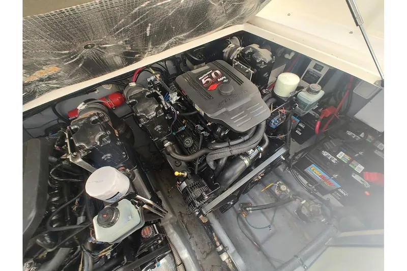 Slide: The Image of Engine compartment of a 2003 Sea Ray Sundancer 280 boat, featuring a Mercury 5.0 MPI engine. - 37