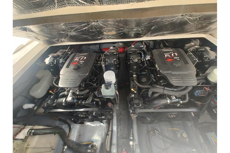 Slide: The Image of Engine compartment of a 2003 Sea Ray Sundancer 280 with twin MerCruiser 5.0 MPI engines. - 38