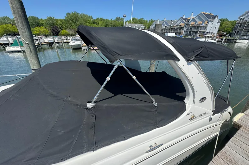 Slide: The Image of 2003 Sea Ray Sundancer 280 docked with black canopy cover. - 43