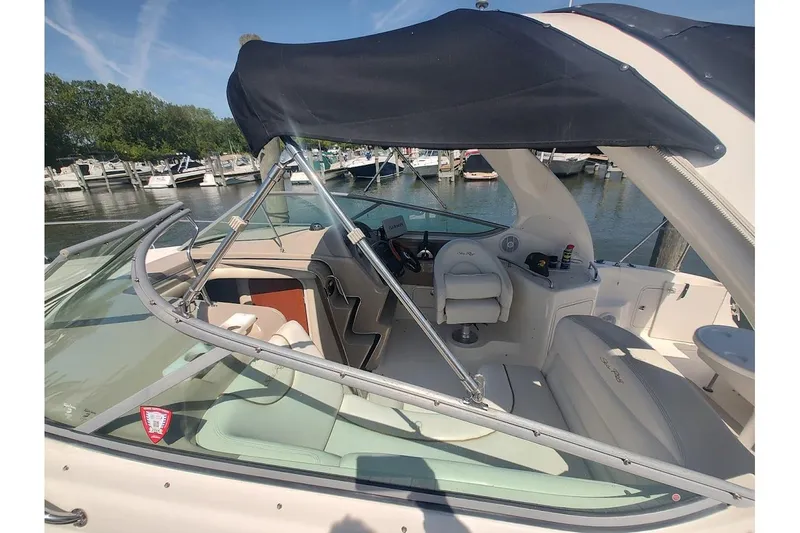 Slide: The Image of 2003 Sea Ray Sundancer 280 boat interior with canopy, docked at marina. - 5