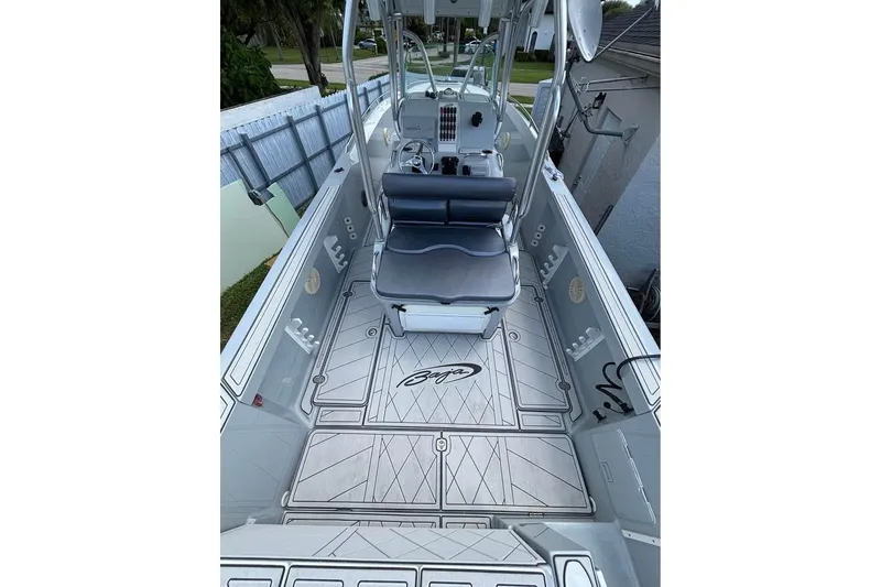 Slide: The Image of 2004 Baja 340 Sportfish boat interior with seating and fishing rod holders. - 8