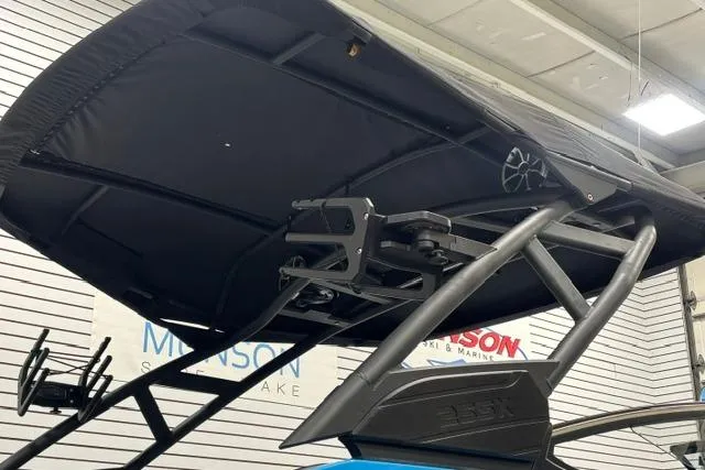 Slide: The Image of 2023 Yamaha Boats 255XE wakeboard tower with speakers in showroom. - 12