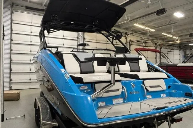Slide: The Image of 2023 Yamaha Boats 255XE in a garage, showcasing sleek design and modern features. - 19