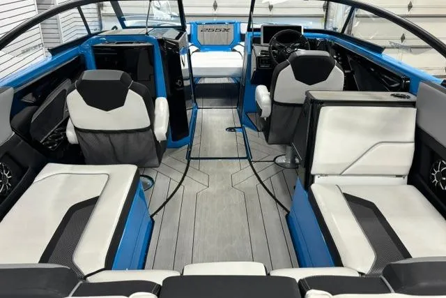Slide: The Image of 2023 Yamaha Boats 255XE interior with modern seating and sleek design. - 22