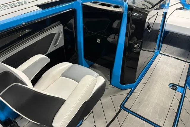 Slide: The Image of 2023 Yamaha Boats 255XE interior with sleek seating and modern design. - 23
