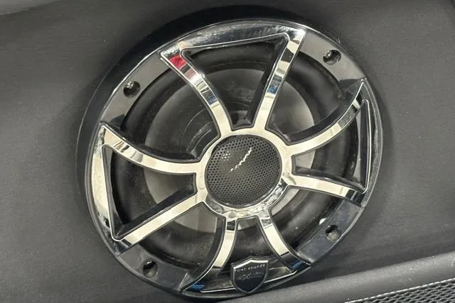 Slide: The Image of 2023 Yamaha Boats 255XE speaker with sleek chrome design. - 24