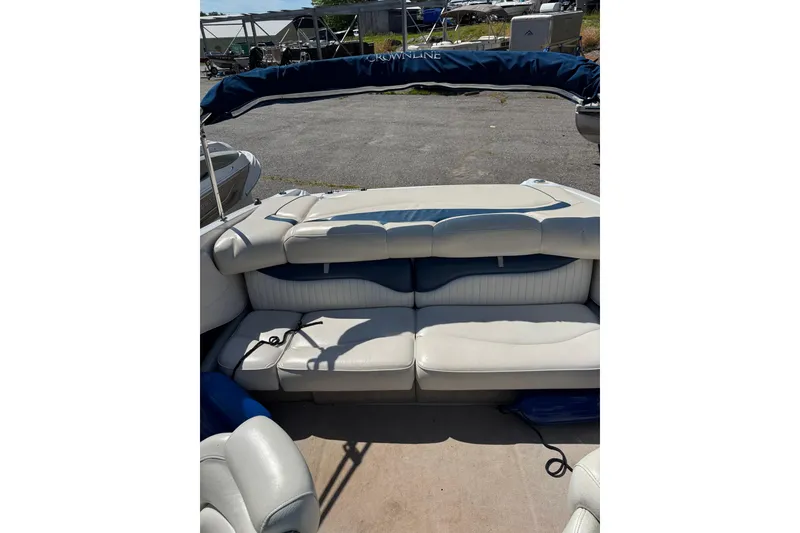 Slide: The Image of 2006 Crownline 21 Classic boat interior with white and blue seating. - 6