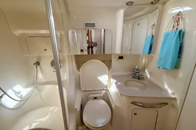Slide: The Image of Luxurious bathroom in 2000 Sea Ray 410 Express Cruiser with shower and vanity. - 16