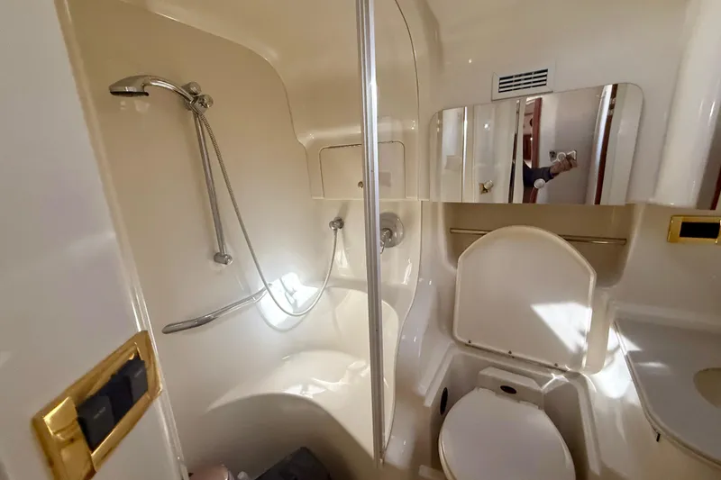 Slide: The Image of Bathroom interior of 2000 Sea Ray 410 Express Cruiser with shower and toilet. - 17