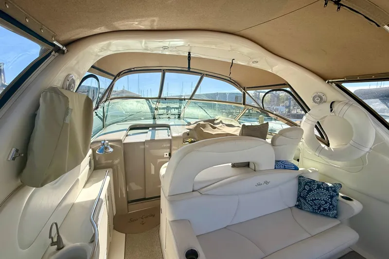 Slide: The Image of Interior of a 2000 Sea Ray 410 Express Cruiser with plush seating and nautical decor. - 5