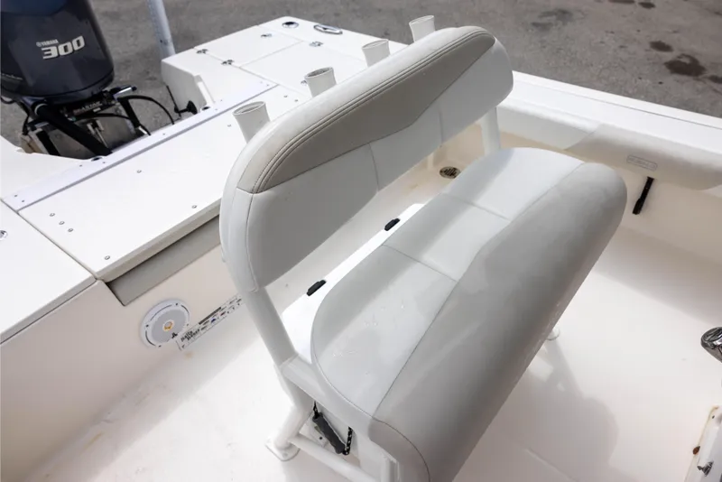Slide: The Image of 2015 Robalo 246 Cayman boat interior with seating and Yamaha 300 engine. - 14