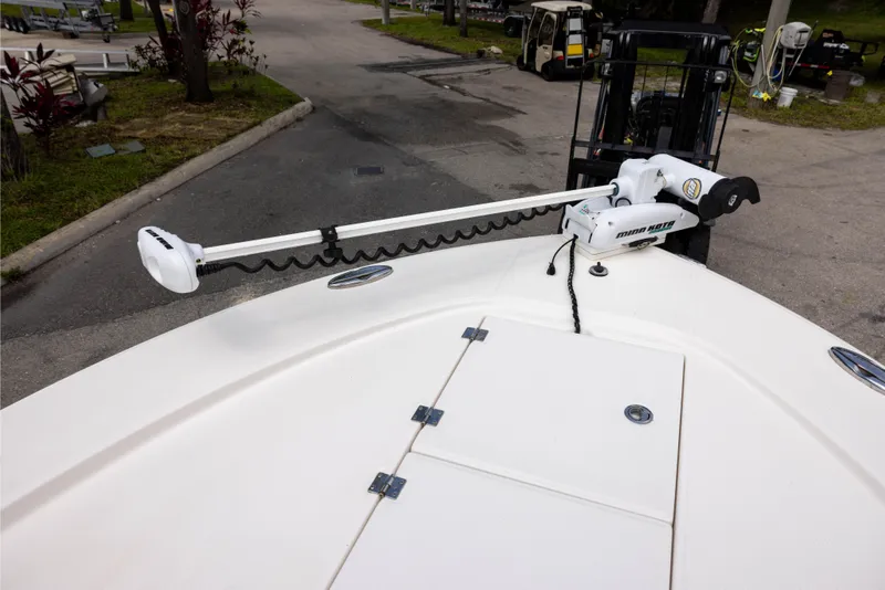 Slide: The Image of 2015 Robalo 246 Cayman boat with Minn Kota trolling motor on deck. - 17