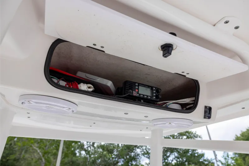Slide: The Image of Storage compartment on 2015 Robalo 246 Cayman boat with electronic equipment and wiring. - 19