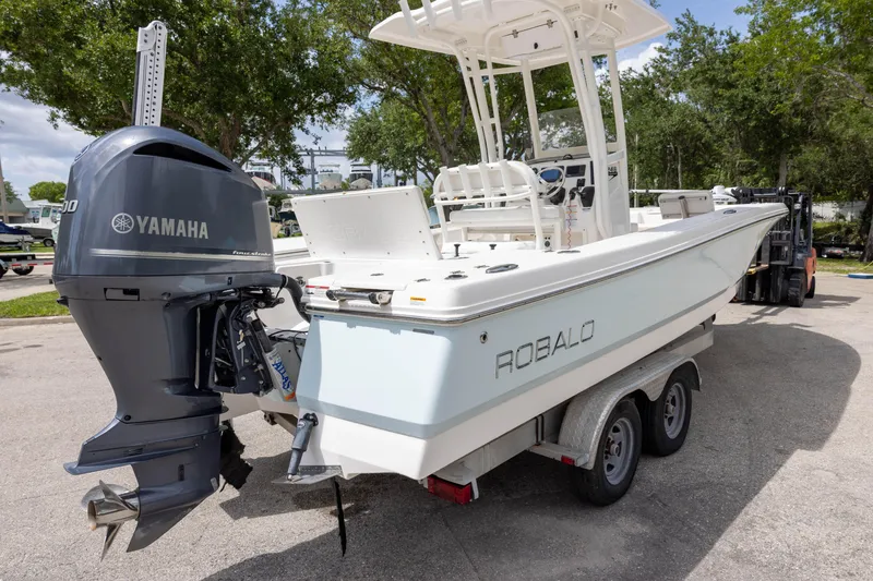 Slide: The Image of 2015 Robalo 246 Cayman boat with Yamaha engine on trailer. - 3