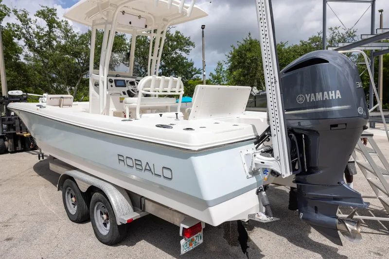 Slide: The Image of 2015 Robalo 246 Cayman boat with Yamaha engine on trailer. - 4