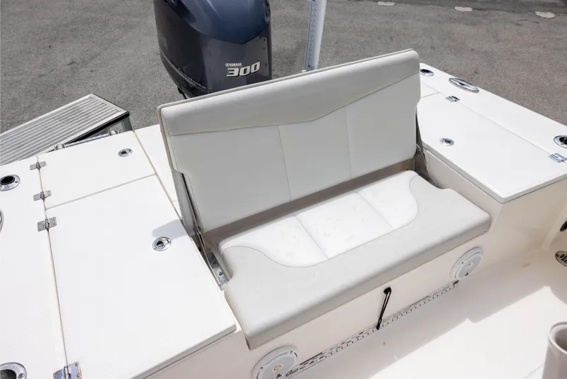 Slide: The Image of 2015 Robalo 246 Cayman boat seat with Yamaha 300 engine in background. - 8