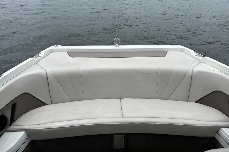 Slide: The Image of Rear seating area of a 1995 Cobalt 253 boat with white upholstery. - 14