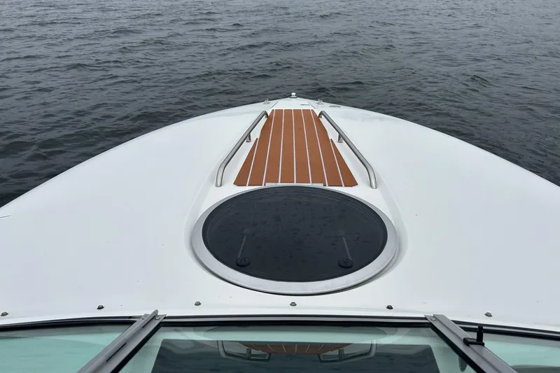 Slide: The Image of Bow view of a 1995 Cobalt 253 boat on water. - 4