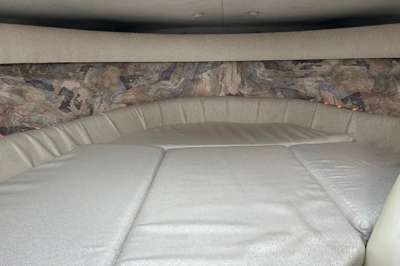 Slide: The Image of Interior cabin of a 1995 Cobalt 253 boat with cushioned seating. - 9