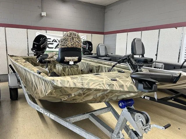 The Image of 2026 Lowe Skorpion SS boat with camouflage design in showroom. - 1