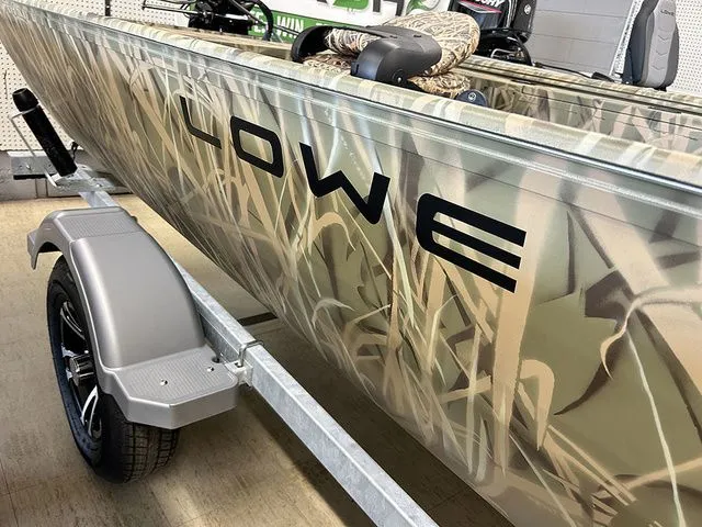 Slide: The Image of Lowe Skorpion SS 2026 boat with camouflage design on trailer. - 4