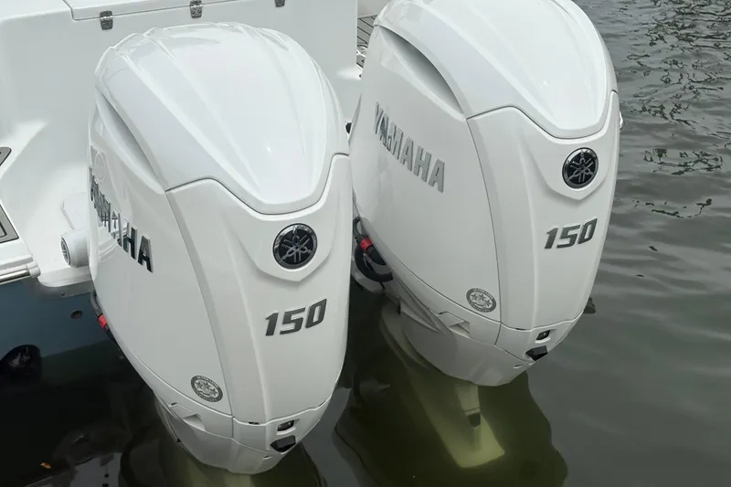 Slide: The Image of Twin Yamaha 150 outboard engines on a 2025 Sea Hunt Gamefish 25 boat. - 12