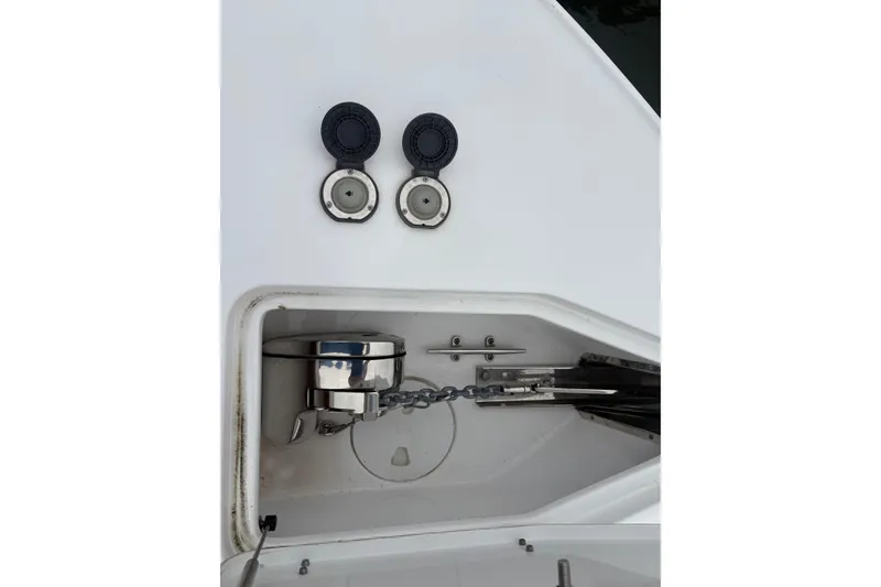 Slide: The Image of Anchor compartment of 2025 Sea Hunt Gamefish 25 boat with chain and fittings. - 22