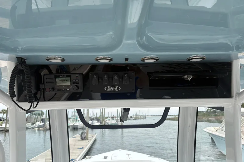 Slide: The Image of Interior view of 2025 Sea Hunt Gamefish 25 boat console with electronic controls. - 25
