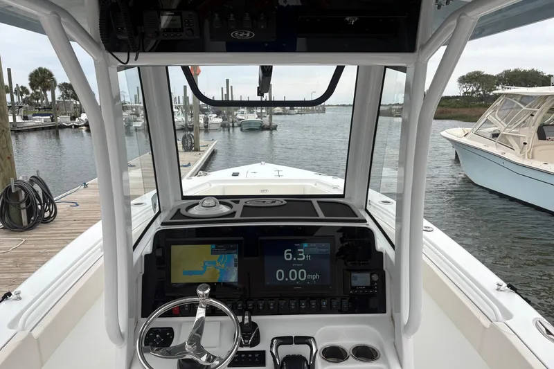 Slide: The Image of Interior view of 2025 Sea Hunt Gamefish 25 boat cockpit with navigation display. - 27