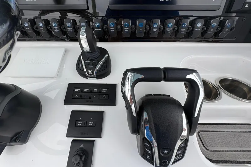 Slide: The Image of Control panel of 2025 Sea Hunt Gamefish 25 boat with Yamaha throttle and switches. - 29