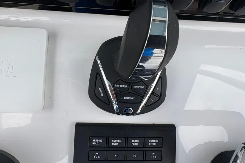 Slide: The Image of Joystick control panel on a 2025 Sea Hunt Gamefish 25 boat dashboard. - 31