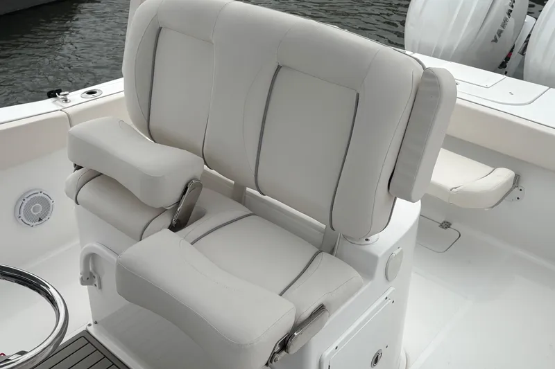 Slide: The Image of 2025 Sea Hunt Gamefish 25 boat seating with cushioned armrests and sleek design. - 36