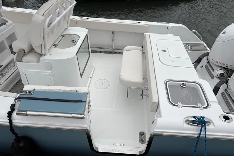 Slide: The Image of 2025 Sea Hunt Gamefish 25 boat interior with seating and storage compartments. - 38