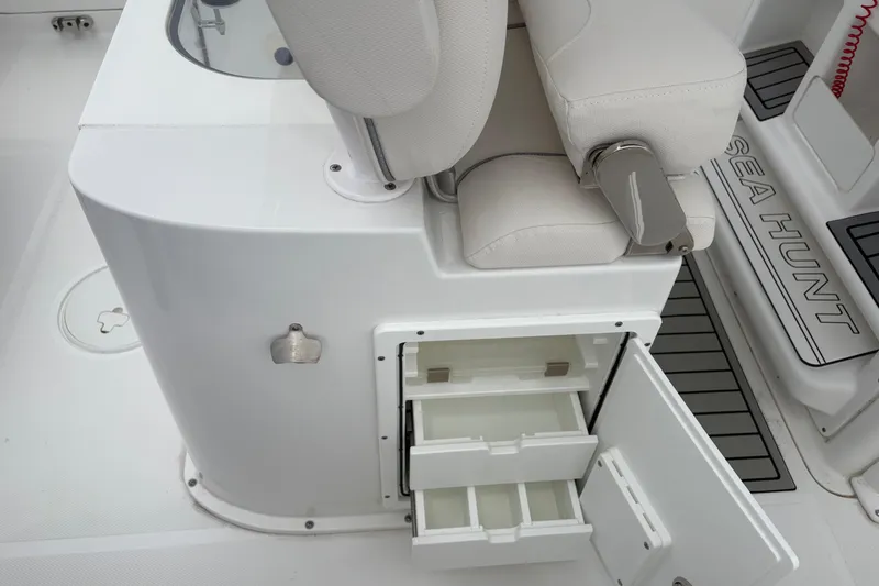 Slide: The Image of 2025 Sea Hunt Gamefish 25 boat interior with open storage compartments and seating. - 43