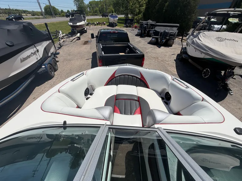 Slide: The Image of Interior of a 2015 MB SPORTS B52 23 boat on a parking lot. - 23