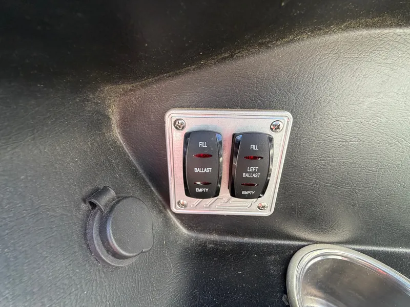 Slide: The Image of Ballast control switches in 2015 MB SPORTS B52 23 boat. - 27