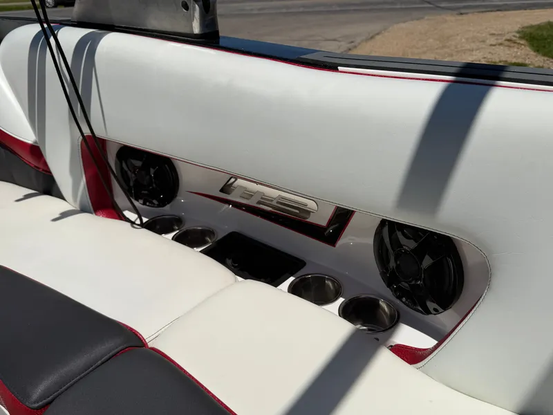 Slide: The Image of Interior of a 2015 MB SPORTS B52 23 boat with speakers and cup holders. - 30