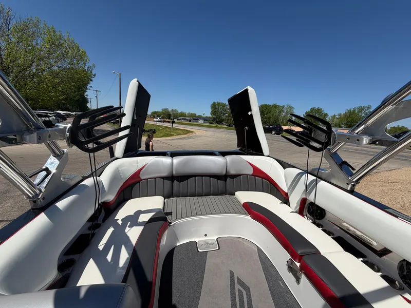 Slide: The Image of Interior of a 2015 MB SPORTS B52 23 boat with gray and red seating. - 34