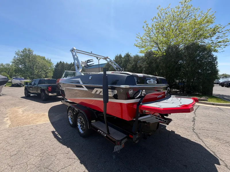 Slide: The Image of 2015 MB SPORTS B52 23 boat parked on trailer outdoors. - 4