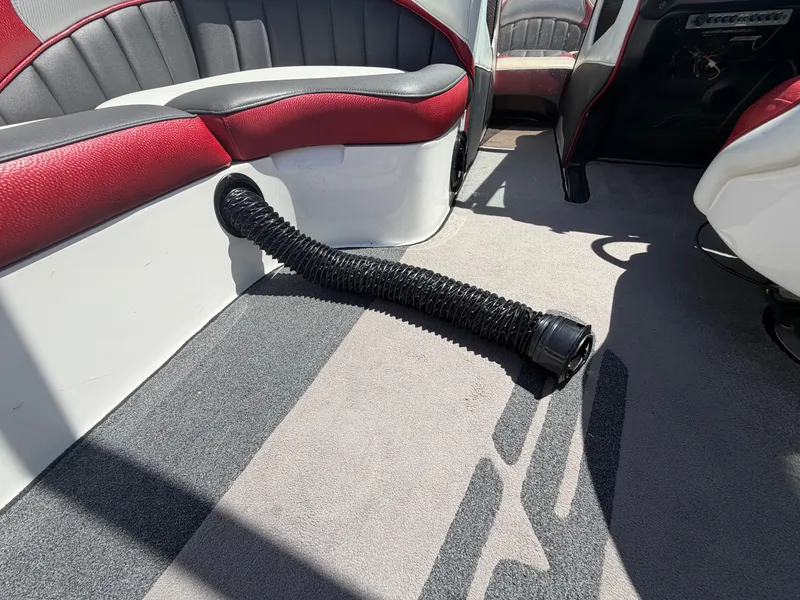Slide: The Image of Interior of a 2015 MB SPORTS B52 23 boat with red and gray upholstery. - 41
