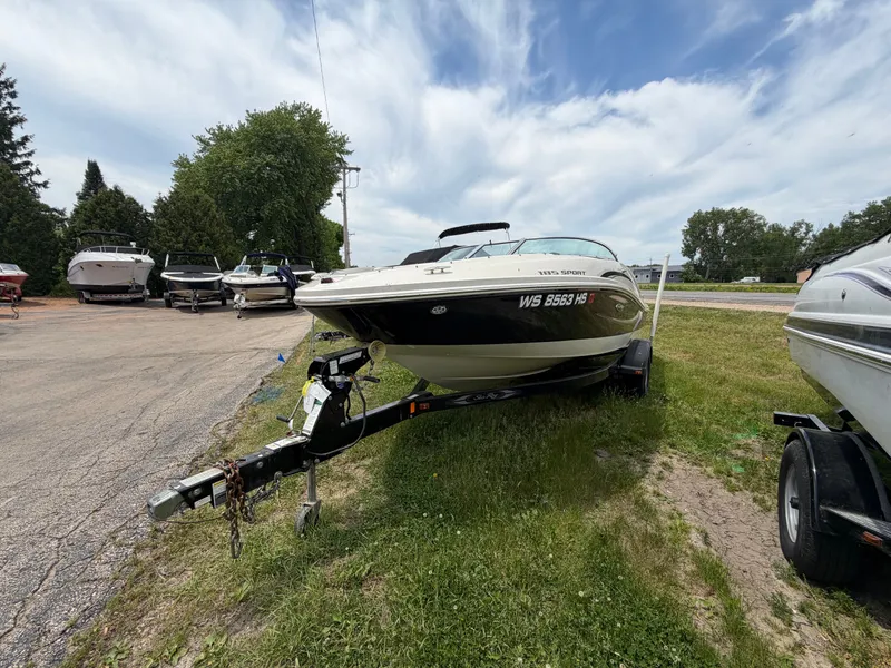 Slide: The Image of 2010 Sea Ray 185 SP/SS boat on trailer outdoors. - 12