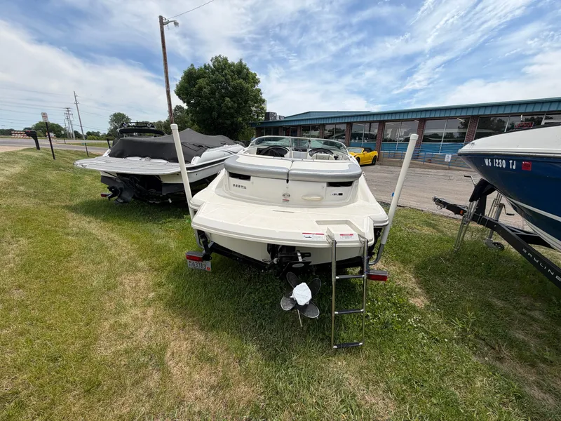 Slide: The Image of 2010 Sea Ray 185 SP/SS boat parked on grass. - 14