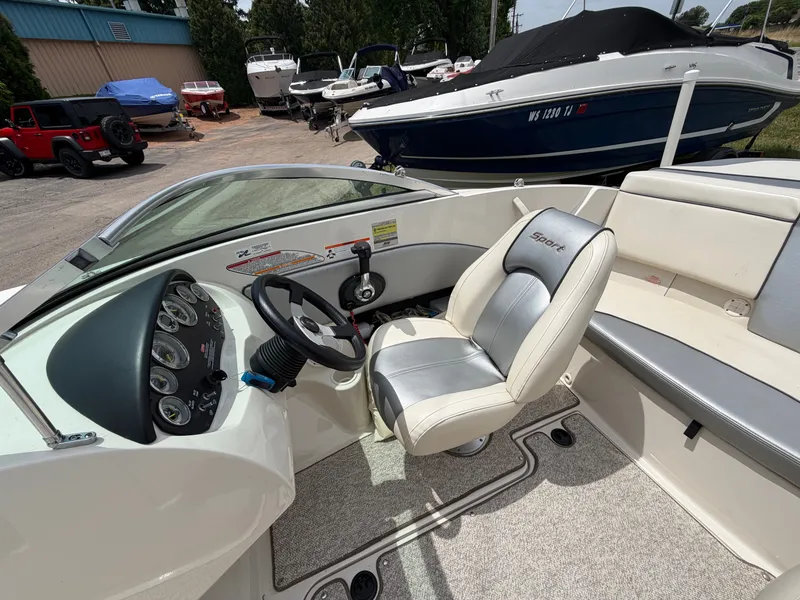 Slide: The Image of Interior of a 2010 Sea Ray 185 SP/SS boat with steering console. - 23