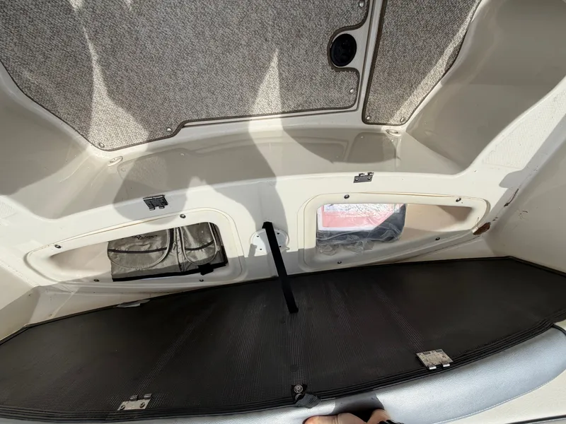 Slide: The Image of Interior of a 2010 Sea Ray 185 SP/SS boat, storage compartment view. - 35
