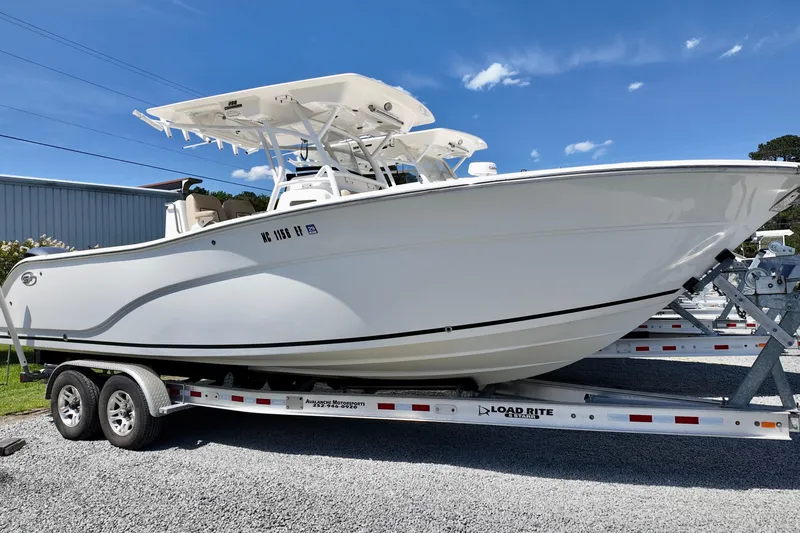The Image of 2017 Sea Fox 288 Commander boat on trailer under clear blue sky. - 0