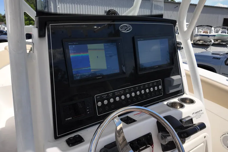 Slide: The Image of Control panel of a 2017 Sea Fox 288 Commander boat with dual displays. - 11