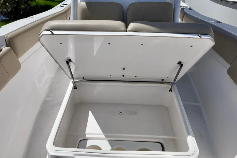 Slide: The Image of Open storage compartment on a 2017 Sea Fox 288 Commander boat, showcasing seating and interior. - 13