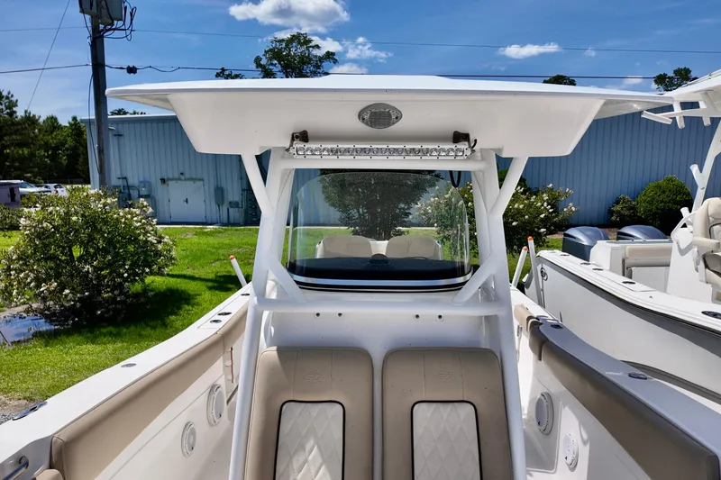 Slide: The Image of 2017 Sea Fox 288 Commander boat interior with seating and overhead canopy. - 16